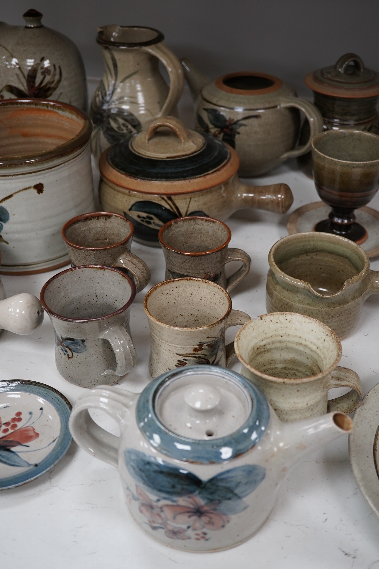 A large collection of Studio ceramics by John Davidson, Truro Pottery, largest item casserole pot and cover 20cm high (31). Condition - teapot has cover missing, but rest mostly good